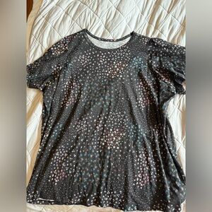 NWOT torrid size 4 flutter sleeve shirt. Black base with multi color flower